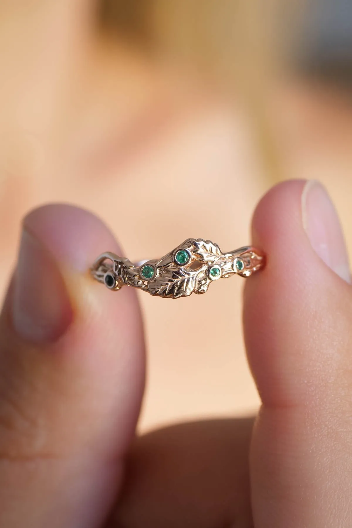 Twig wedding band with emeralds and three leaves, branch wedding ring